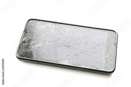 Broken smartphone screen on white background. Selective focus.