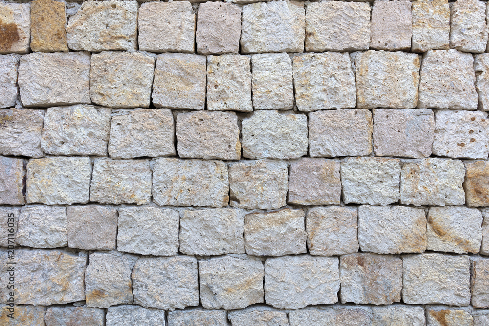 Texture of a stone wall from a large cobblestone shell closeup Texture of a stone wall from a large cobblestone shell closeup