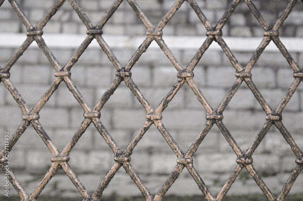 Fototapeta premium old-fashioned forging with a background of stones