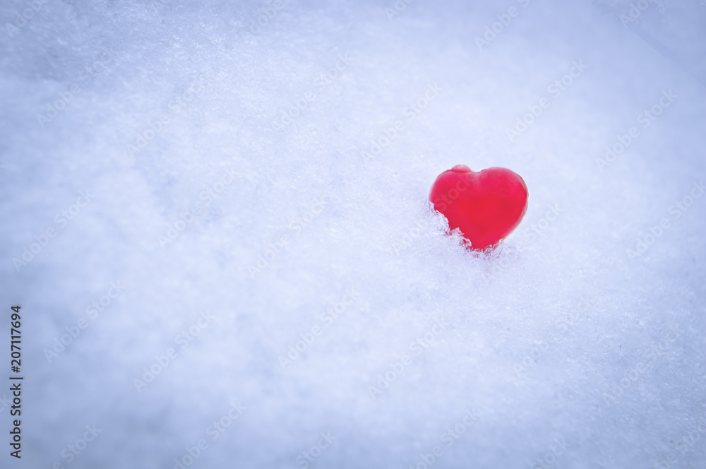red heart on a snow-white background of snow red heart on a snow-white background of snow