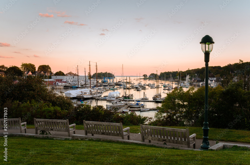 Empty Wooden Benches Facing a Scenic Harbour at Twilight. Camden, ME, United States