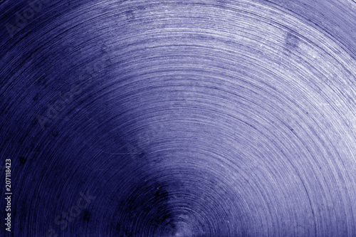 Metal surface with scratches in blue tone.