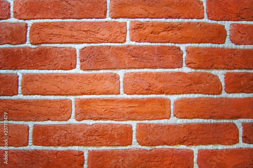 background with an orange brick wall and white seams