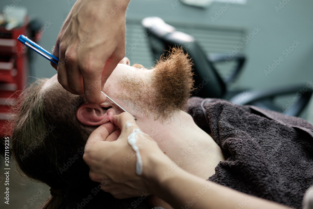 man is bearded and shaved in barbershop man is bearded and shaved in barbershop