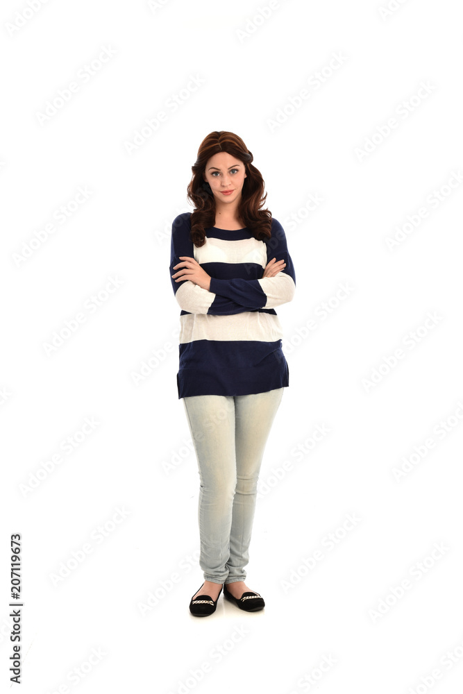 full length portrait of girl wearing striped blue and white jumper and jeans. standing pose on white studio background full length portrait of girl wearing striped blue and white jumper and jeans. standing pose on white studio background