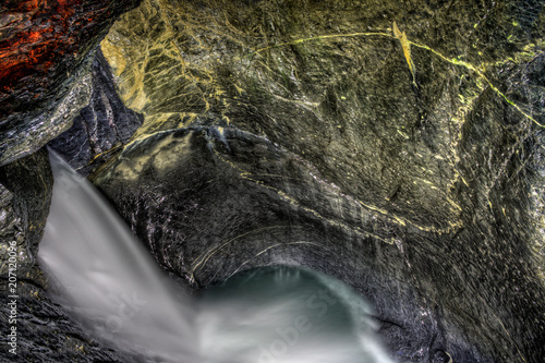 Underground waterfall Trümmelbach Falls Switzerland.. photo