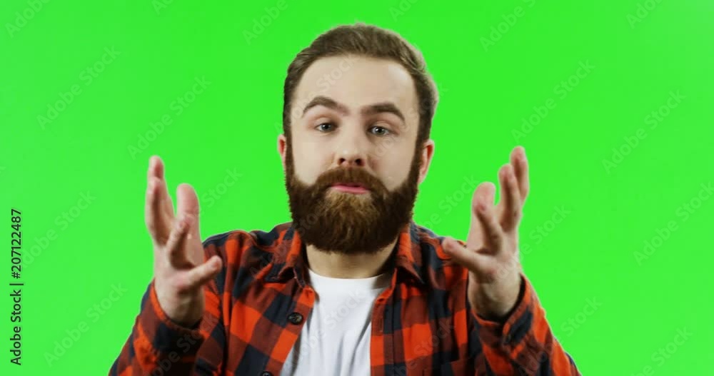Close up of the caucasian man turning his head to the camera and saying what angrily to the camera. Green screen. chroma key. Close up of the caucasian man turning his head to the camera and saying what angrily to the camera. Green screen. chroma key.