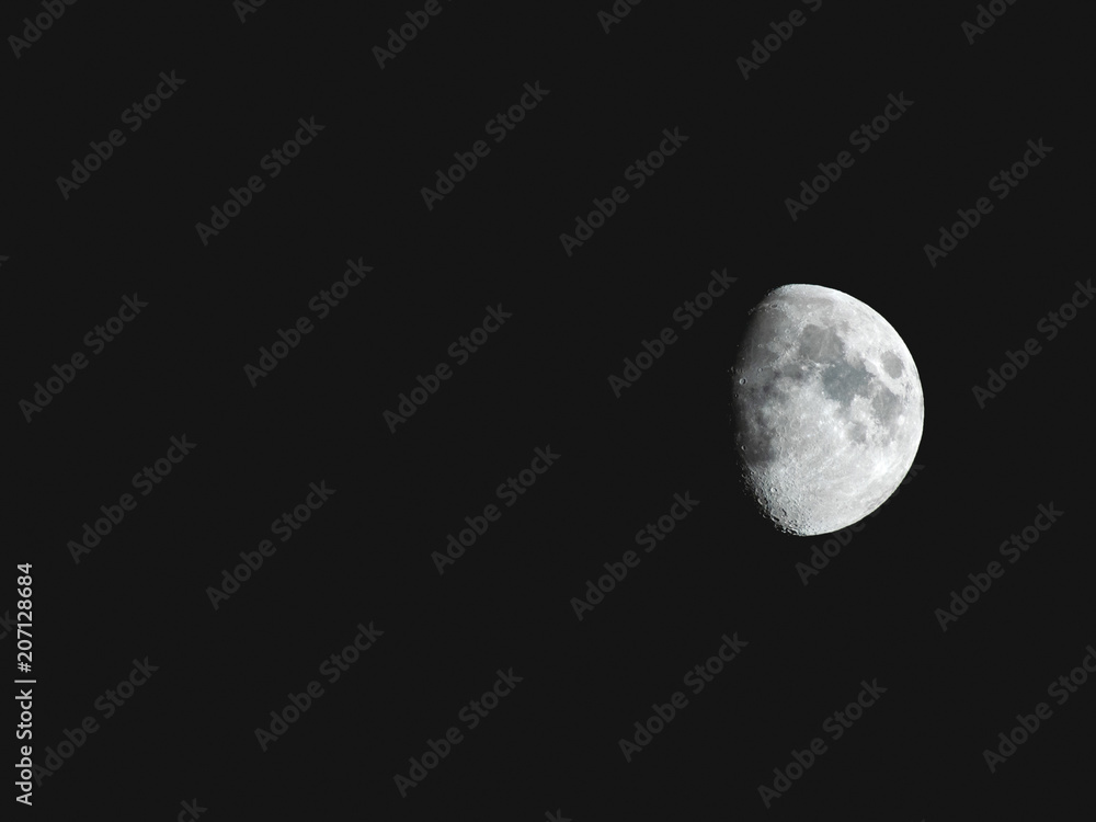 Natural night background with dark sky and half Moon, Earth satellite. Waxing gibbous phase. Natural night background with dark sky and half Moon, Earth satellite. Waxing gibbous phase.