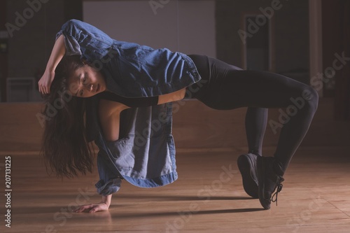 Female dancer dancing in dance studio photo