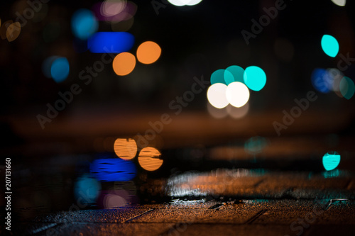 Light bokeh dots in the night after rain. © Eike