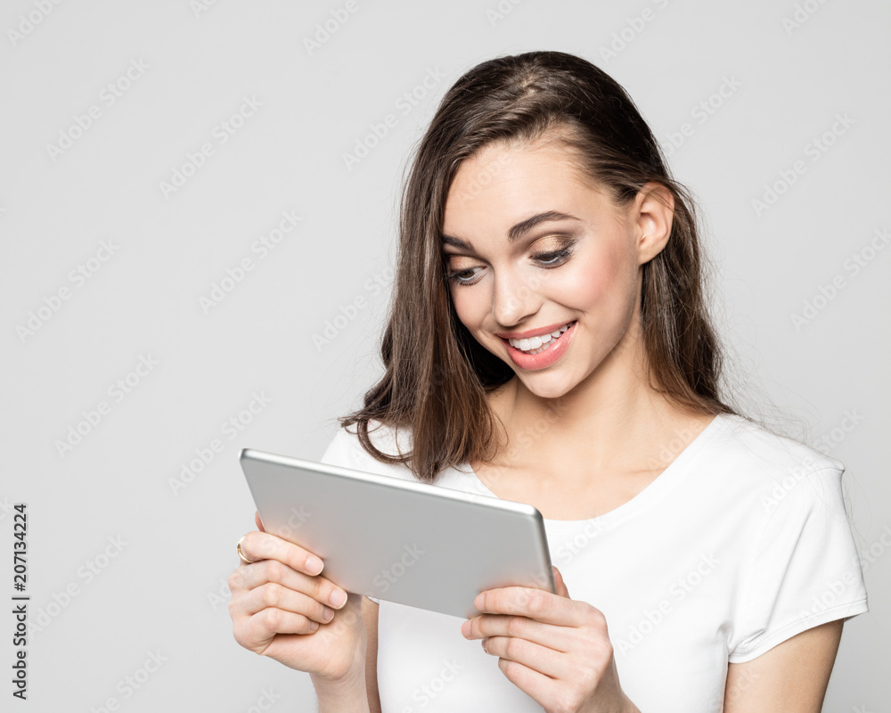 Portrait of surprised young using a digital tablet Portrait of surprised young using a digital tablet