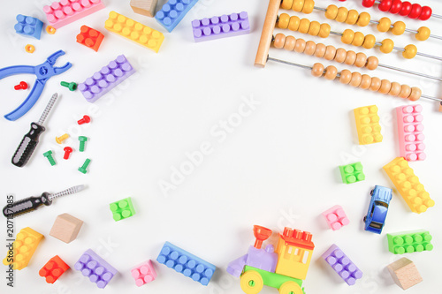 Kids toys frame on white background. Top view. Flat lay.