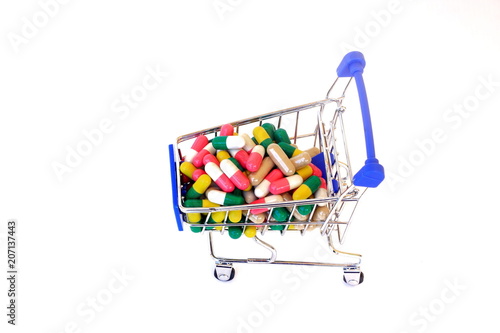 Good health can not buy but medicine is always available.Drug in shopping Cart. photo