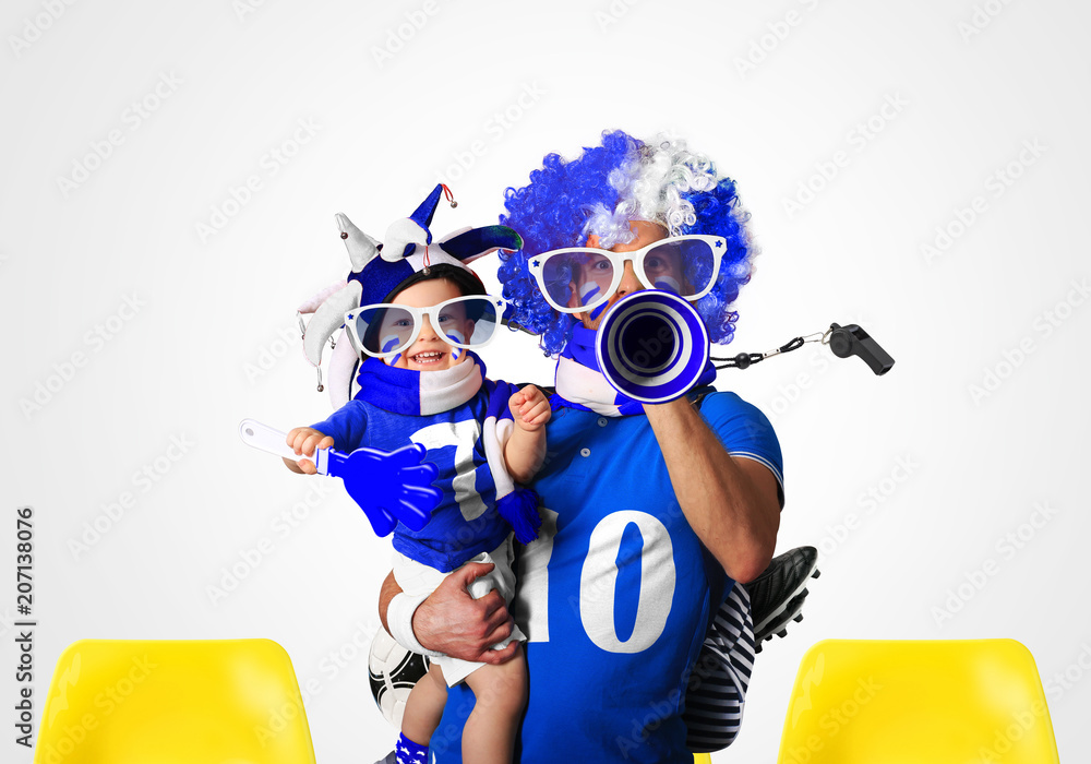 Father In A Wig And The Son Fans In Blue White Colors Stock Photo