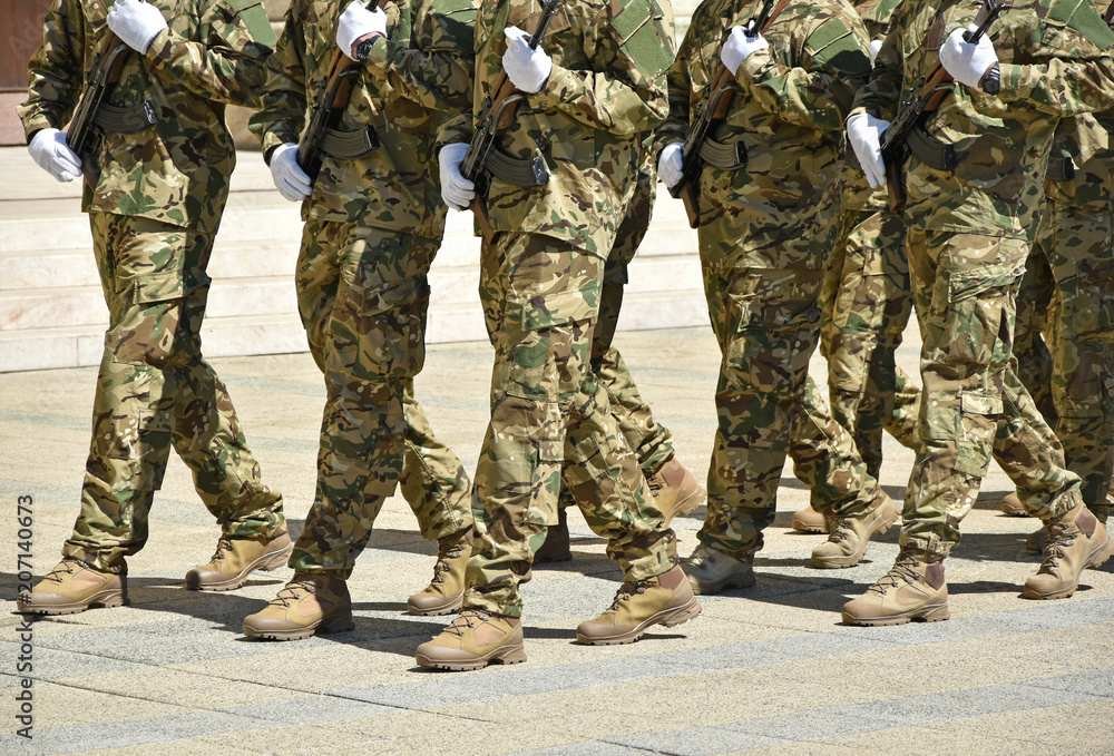 Soldiers are marching at the military parade. Soldiers are marching at the military parade.