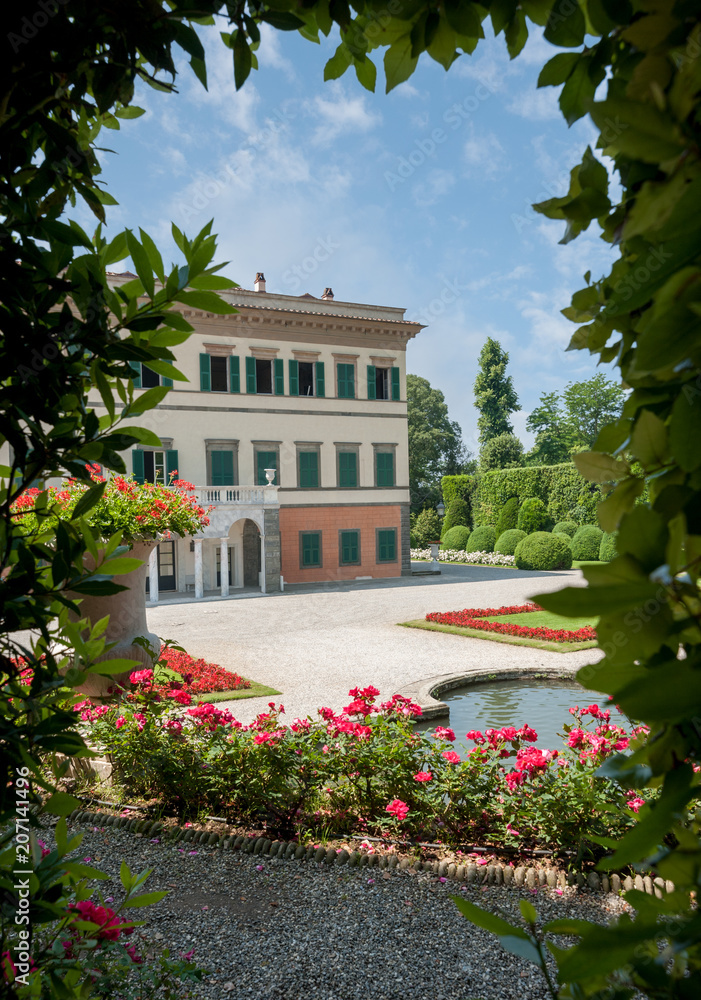 The Theatre of Water, with beautiful colored flowerbeds in the formal garden. Villa Reale facade in the background.