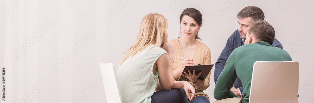 © Photographee.eu - Panorama of female psychologist during meeting with a support group for workaholics