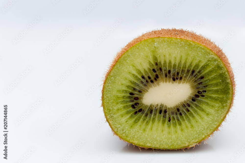sweet ripe kiwi fruits on white, Kiwi cut into slices lay on a yellow plate, serving fruit