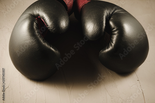boxing concept with gray gloves/boxing concept with gray gloves on a stone background.