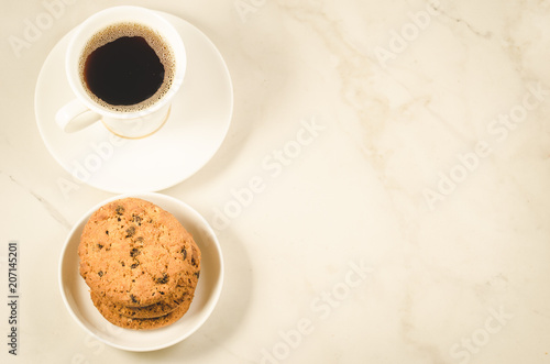 coffee cup and cookies coffee cup and cookies on a marble background  top view and copy space