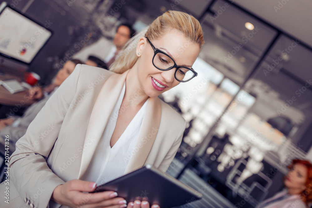 Young businesswoman using digital tablet Young businesswoman using digital tablet