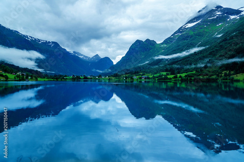 lake in norwegian fjords with reflection