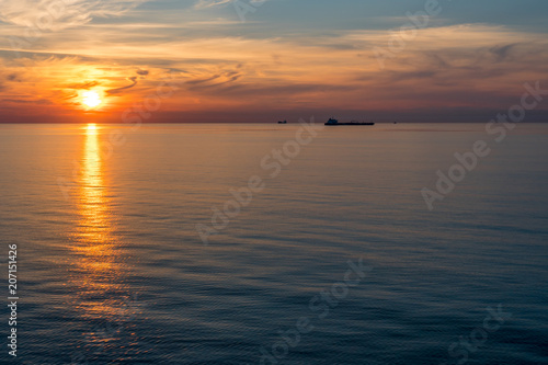 big transporter ship during sunset