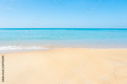 Beautiful sandy beach and tropical sea with blue sky in summer day. © AePatt Journey