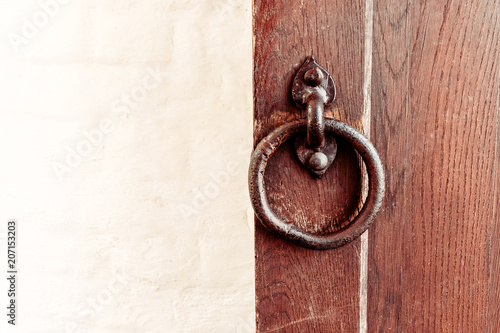Fotografie wooden door gate with a forged handle ring