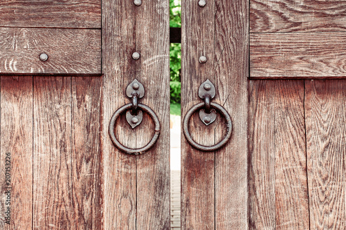 wooden door gate with a forged handle ring