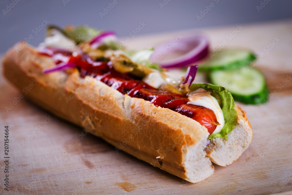 Fresh homemade hot dog on wooden desk Fresh homemade hot dog on wooden desk