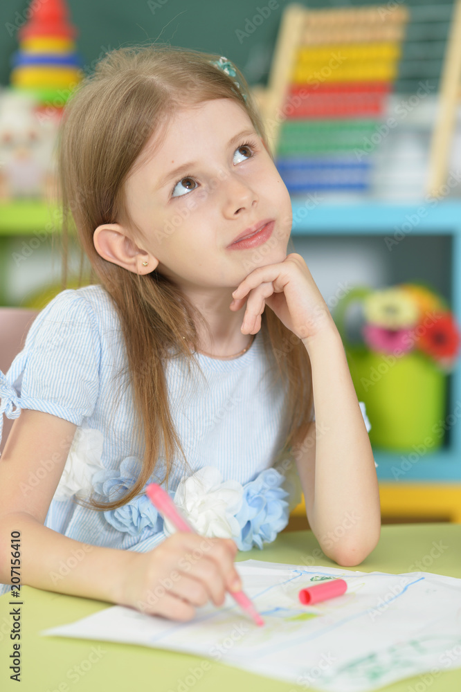 Cute schoolgirl sitting and drawing Cute schoolgirl sitting and drawing