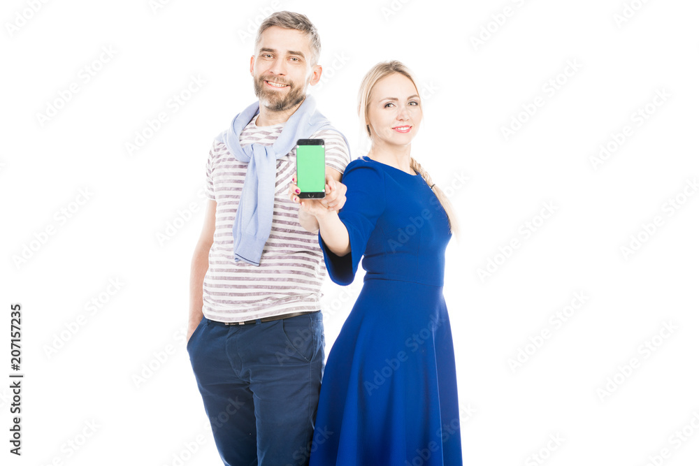 Casual couple showing phone on white background Casual couple showing phone on white background