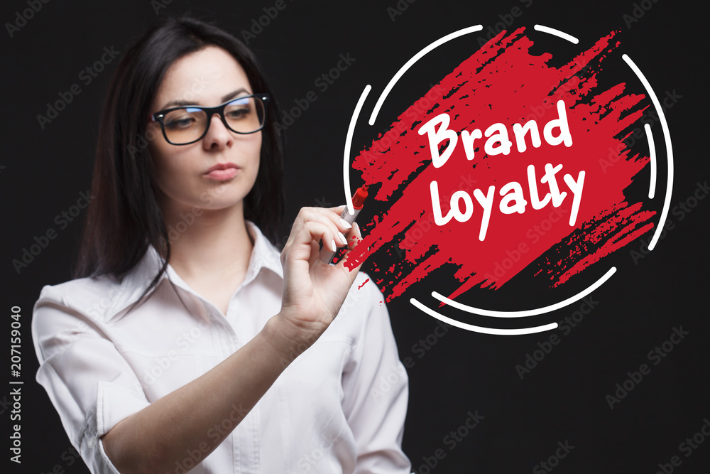The concept of marketing, technology, the Internet and the network. A young businessman shows what is important for business: Brand loyalty The concept of marketing, technology, the Internet and the network. A young businessman shows what is important for business: Brand loyalty