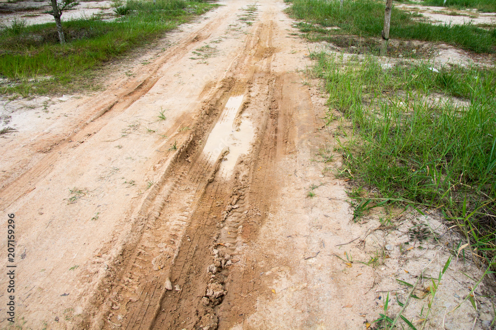 Damaged road with holes, Puddle on asphalt road Damaged road with holes, Puddle on asphalt road