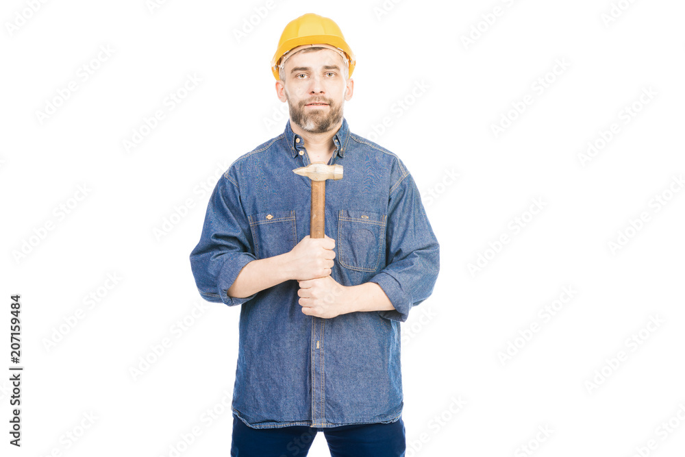 Portrait of bearded Caucasian man in helmet holding hammer and looking at camera on white background Portrait of bearded Caucasian man in helmet holding hammer and looking at camera on white background