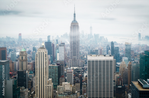 City skyline with the Empire State building on a foggy rainy day, Manhattan, New York, USA