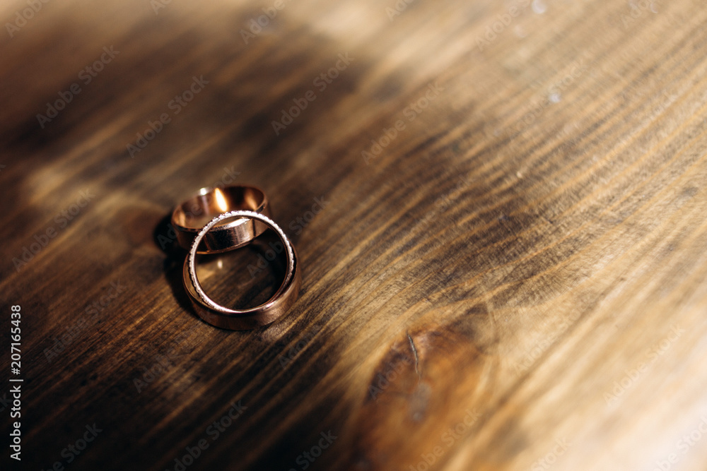The wedding rings stands on the table The wedding rings stands on the table