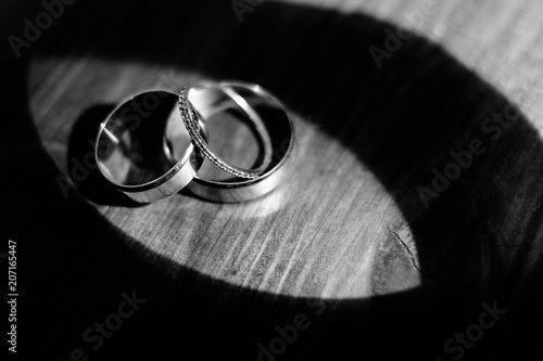 The wedding rings stands on the table