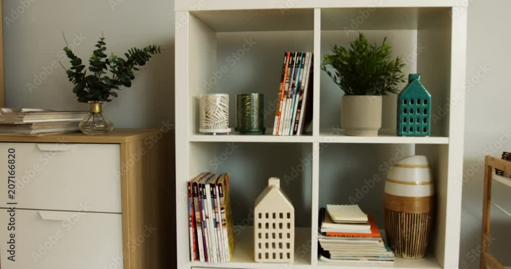 Modern furniture in the living room: shelves with home stuff. Close up. Inside Modern furniture in the living room: shelves with home stuff. Close up. Inside