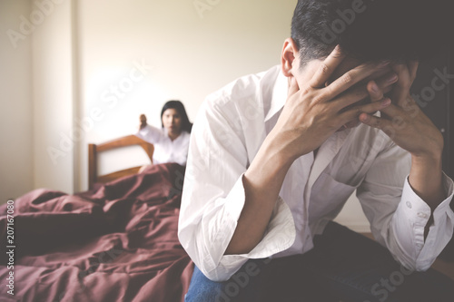 Handsome man is disappointed his self that his wife tells him that she get disappointed him because he get impotence. He get shy and failure. Guy get sadness, unhappy with unsatisfied woman background photo