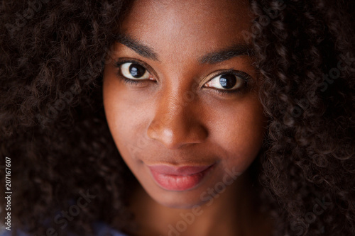 Close up attractive young african woman with curly hair