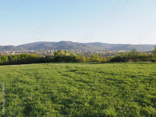Awesome panorama of cityscape european Bielsko-Biala city and countryside landscape of grassy field at Beskids, POLAND