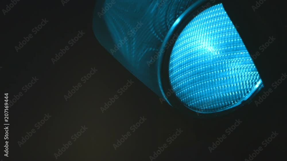 Traffic light turn green light on in the night. This clip was shot with