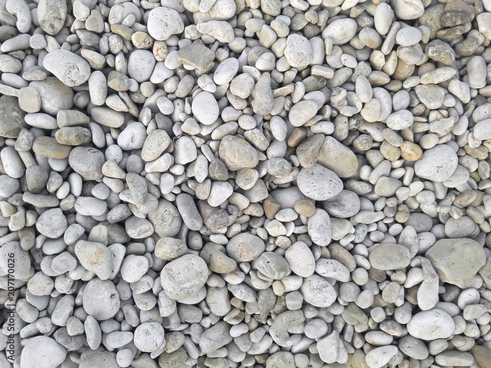 Sea round glossy stones background, top view. Sea round glossy stones background, top view.