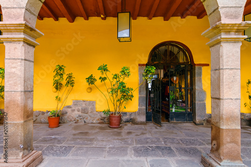 Corridor of an internal courtyard of a Peruvian house with stone columns