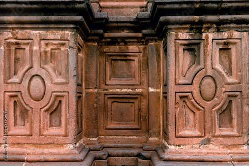 Close-up of stone moldings on the wall of a church in Cusco, Peru photo