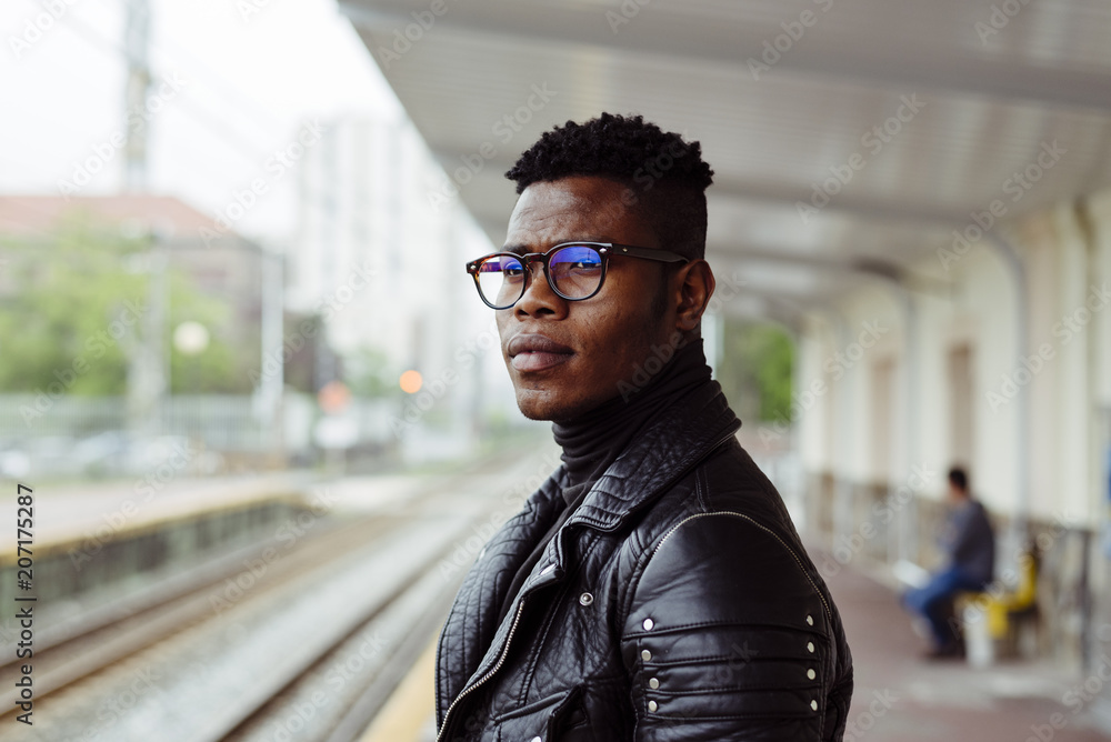 Black man standing on platform Black man standing on platform