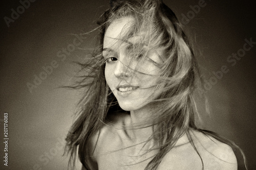Portrait of young beautiful woman with healthy skin. Retro styled photo with grain effect