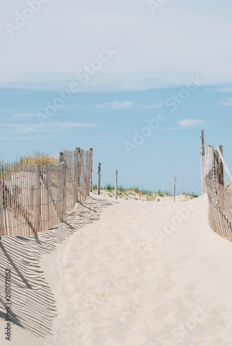 Entrance to a beach with wood fence